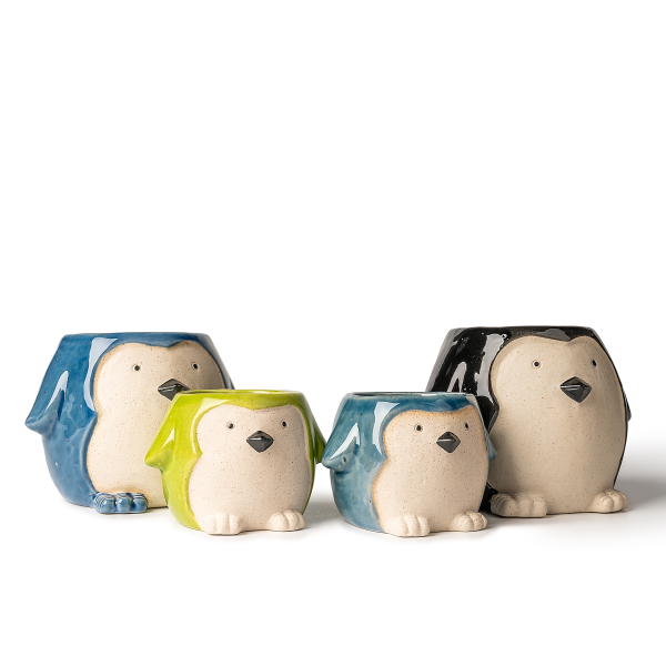 पेंगुइन के आकार के सिरेमिक मोमबत्ती धारक: मनमोहक और आरामदायक प्रकाश और छाया कला